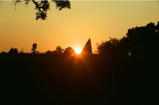 Winter-Solstice-sunset-framed-by-two-Menhirs-at-Nilaskal-in-Southern-India